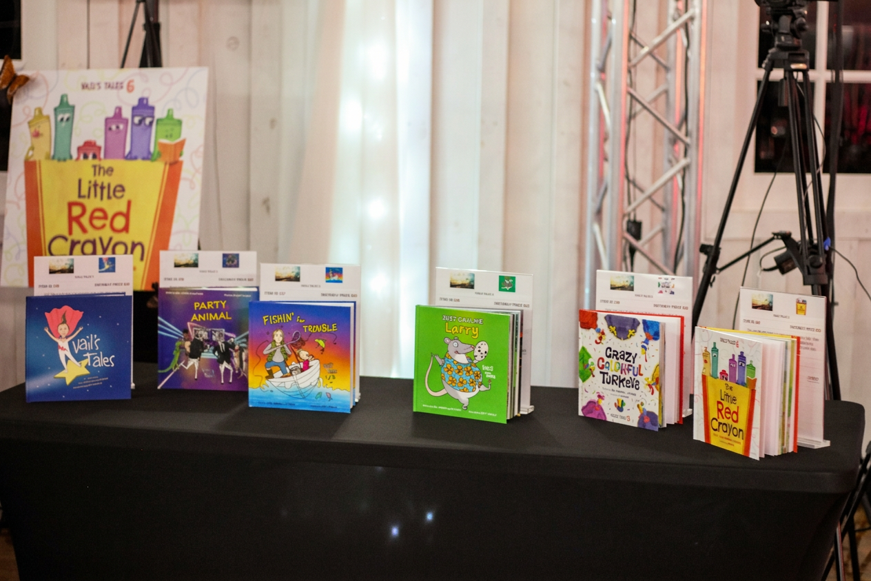 Friends of Vail Foundation’s Vail’s Tales children’s book collection displayed at Dinner With Friends, celebrating Vail Johnson’s legacy of storytelling, childhood literacy, and inspiring young readers through imagination and education.